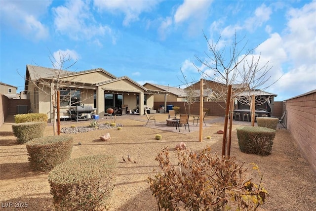 7115 Calvert Cliffs St, North Las Vegas, NV 89084 - back of house with an outdoor fire pit, a patio, and a fenced backyard