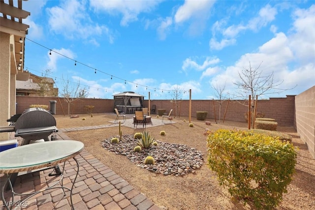 7115 Calvert Cliffs St, North Las Vegas, NV 89084 - fenced backyard featuring a gazebo and a patio area