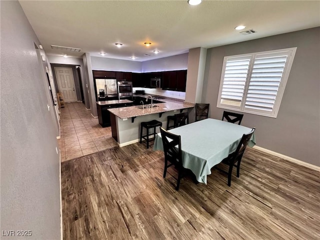 7035 Thistle Ridge St, Las Vegas, NV 89166 - dining area featuring wood finished floors, baseboards, and recessed lighting