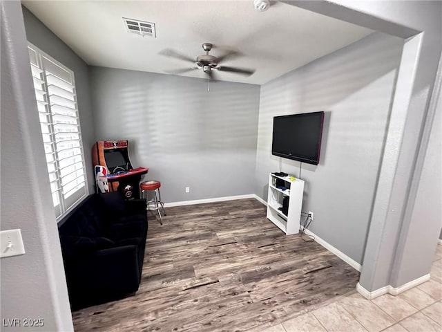 7035 Thistle Ridge St, Las Vegas, NV 89166 - living area with a ceiling fan, wood finished floors, and baseboards