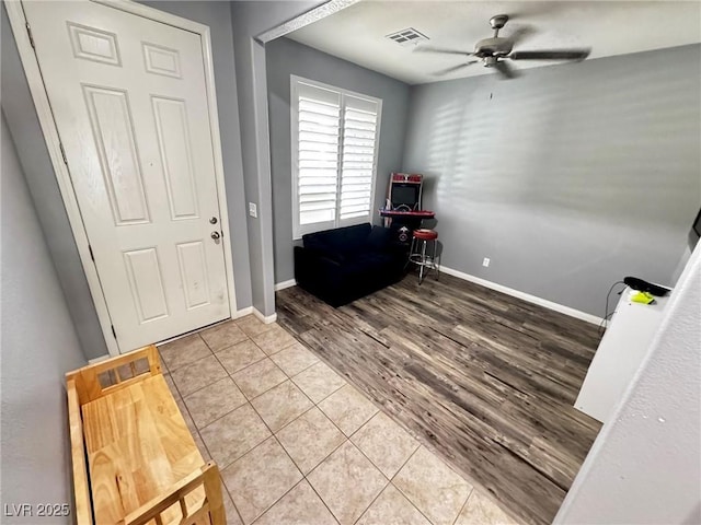 7035 Thistle Ridge St, Las Vegas, NV 89166 - foyer entrance with ceiling fan, baseboards, and tile patterned flooring
