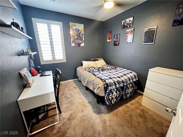7035 Thistle Ridge St, Las Vegas, NV 89166 - carpeted bedroom featuring a textured wall, ceiling fan, and baseboards