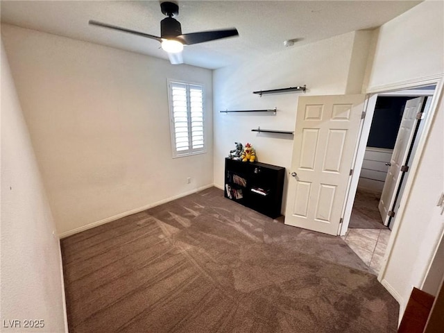 7035 Thistle Ridge St, Las Vegas, NV 89166 - bedroom featuring dark colored carpet, ceiling fan, and baseboards