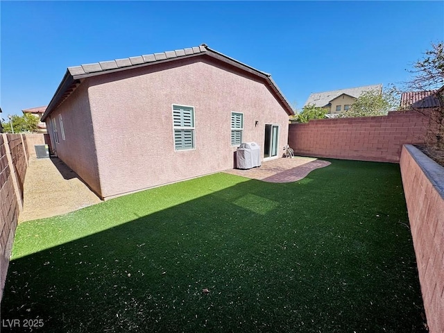7035 Thistle Ridge St, Las Vegas, NV 89166 - rear view of property with stucco siding and central AC