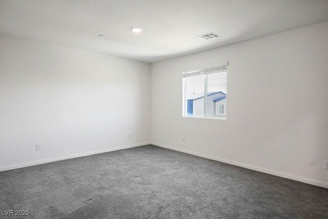 532 Clearsable Ave, Henderson, NV 89044 - empty room featuring dark colored carpet and baseboards