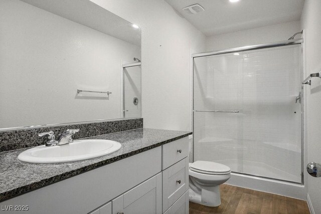 532 Clearsable Ave, Henderson, NV 89044 - full bathroom with a shower stall, vanity, toilet, and wood finished floors