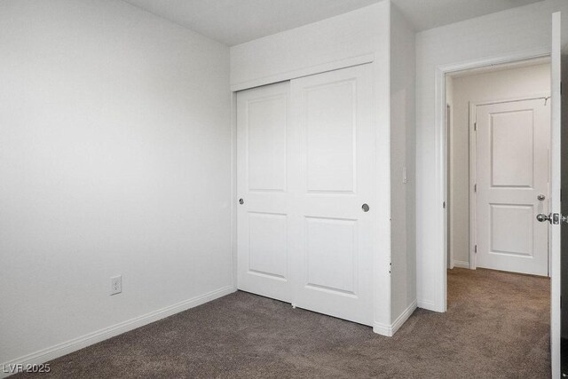 532 Clearsable Ave, Henderson, NV 89044 - unfurnished bedroom with dark colored carpet, a closet, and baseboards