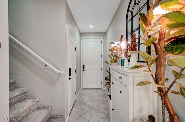 4160 Elegant Chateau St, Las Vegas, NV 89135 - doorway to outside with stairs, light tile patterned floors, recessed lighting, and baseboards