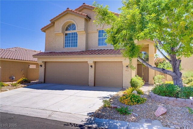 7813 Paper Flower Ct, Las Vegas, NV 89128 - view of front of house with an attached garage, a tile roof, concrete driveway, and stucco siding