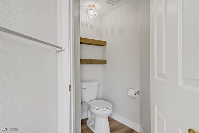 7813 Paper Flower Ct, Las Vegas, NV 89128 - bathroom with toilet, wood finished floors, and baseboards