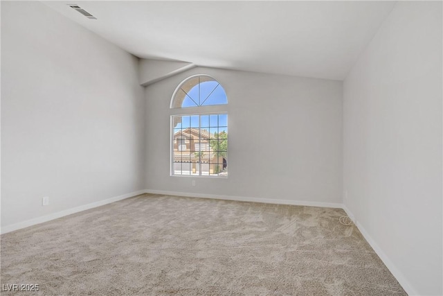 7813 Paper Flower Ct, Las Vegas, NV 89128 - carpeted empty room featuring vaulted ceiling and baseboards