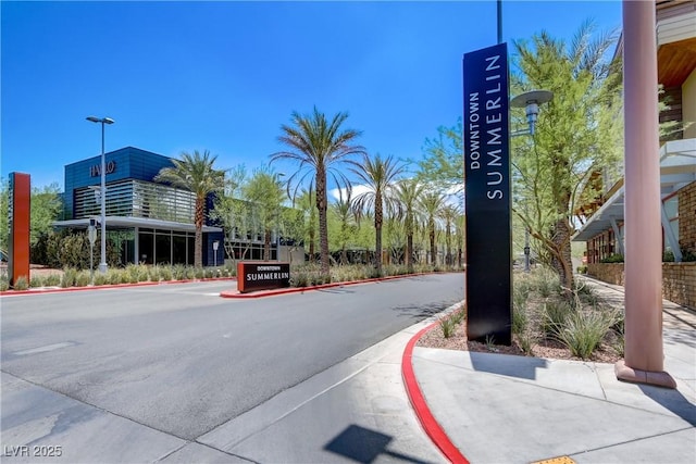 7813 Paper Flower Ct, Las Vegas, NV 89128 - view of asphalt street with curbs, sidewalks, and street lights