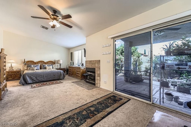 310 Pissarro Pl, Henderson, NV 89074 - carpeted bedroom featuring access to outside, vaulted ceiling, multiple windows, ceiling fan, and a fireplace