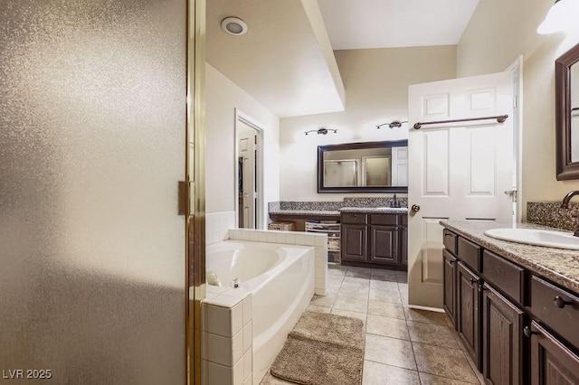 310 Pissarro Pl, Henderson, NV 89074 - bathroom featuring a garden tub, two vanities, a stall shower, and tile patterned floors