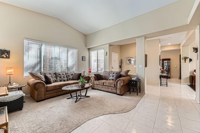 310 Pissarro Pl, Henderson, NV 89074 - living area with light tile patterned floors, vaulted ceiling, and light colored carpet