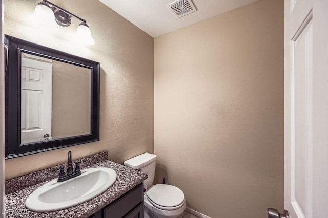310 Pissarro Pl, Henderson, NV 89074 - half bathroom with toilet, vanity, baseboards, and a textured wall