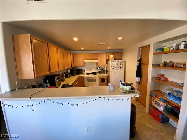 9580 W Reno Ave Unit 283, Las Vegas, NV 89148 - kitchen featuring white appliances, under cabinet range hood, light countertops, a peninsula, and recessed lighting