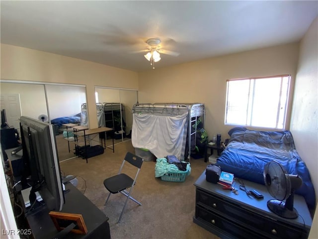 9580 W Reno Ave Unit 283, Las Vegas, NV 89148 - carpeted bedroom with multiple closets and a ceiling fan