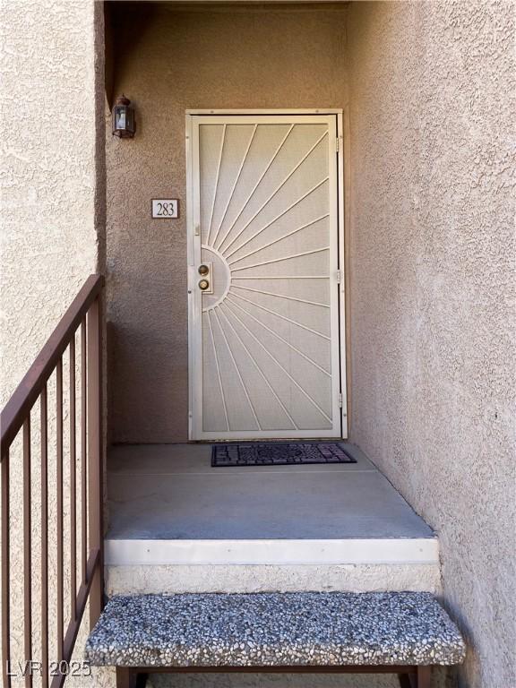 9580 W Reno Ave Unit 283, Las Vegas, NV 89148 - view of exterior entry with stucco siding