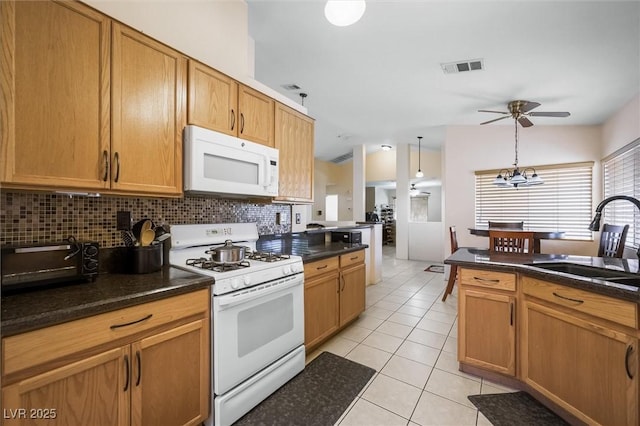 3121 Fontana Colony Ct, North Las Vegas, NV 89031 - kitchen featuring white appliances, a sink, ceiling fan, tasteful backsplash, and light tile patterned floors