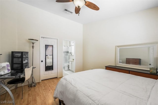 3121 Fontana Colony Ct, North Las Vegas, NV 89031 - bedroom with light wood finished floors, a desk, connected bathroom, and ceiling fan