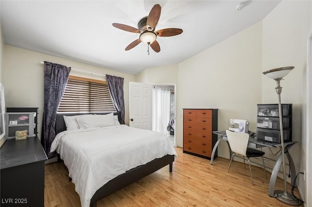 3121 Fontana Colony Ct, North Las Vegas, NV 89031 - bedroom featuring light wood-style floors, vaulted ceiling, a ceiling fan, and a desk