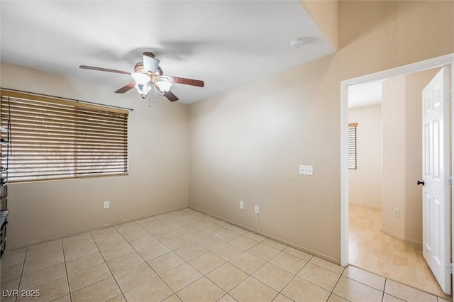 3121 Fontana Colony Ct, North Las Vegas, NV 89031 - unfurnished room featuring a ceiling fan, plenty of natural light, light tile patterned floors, and a smoke detector