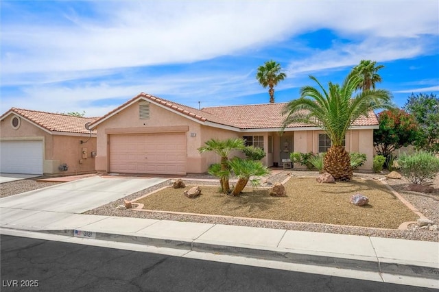 3121 Fontana Colony Ct, North Las Vegas, NV 89031 - ranch-style house with stucco siding, a tiled roof, an attached garage, and concrete driveway