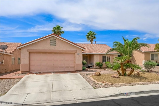 3121 Fontana Colony Ct, North Las Vegas, NV 89031 - view of front of house featuring stucco siding, a garage, a tiled roof, and driveway