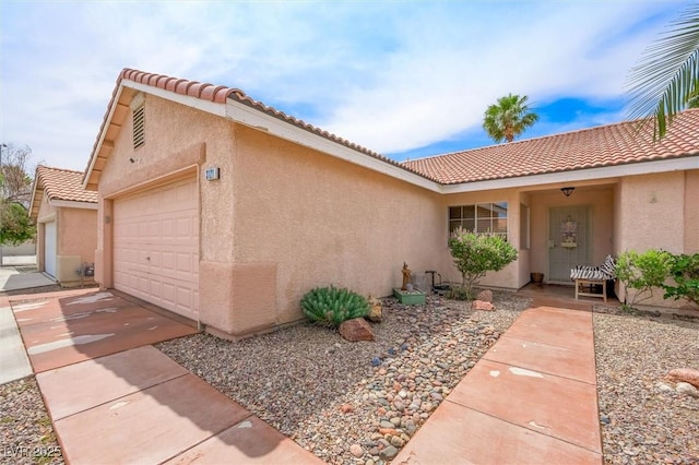 3121 Fontana Colony Ct, North Las Vegas, NV 89031 - view of front of home featuring a tile roof, an attached garage, stucco siding, and concrete driveway