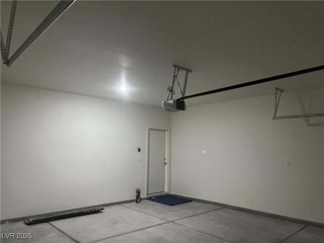 1905 Harvard St, North Las Vegas, NV 89030 - garage featuring a garage door opener and baseboards
