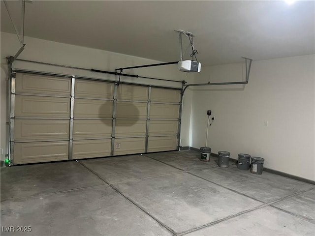 1905 Harvard St, North Las Vegas, NV 89030 - garage featuring a garage door opener and baseboards