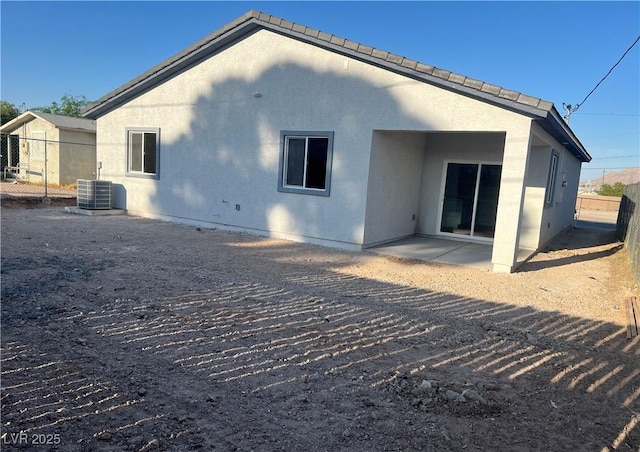 1905 Harvard St, North Las Vegas, NV 89030 - rear view of house with a patio, central AC, and stucco siding