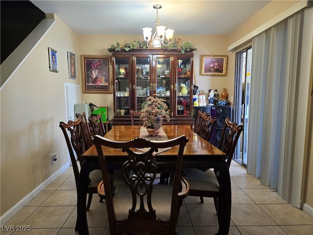 4612 Supreme Ct, Las Vegas, NV 89110 - dining area featuring a chandelier, light tile patterned floors, and baseboards