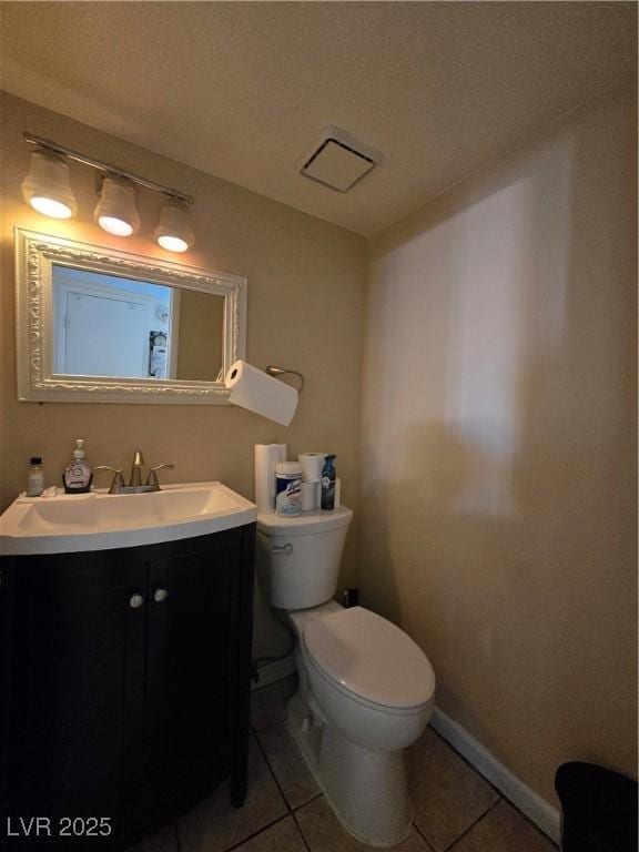 4612 Supreme Ct, Las Vegas, NV 89110 - half bath featuring tile patterned flooring, vanity, toilet, and baseboards