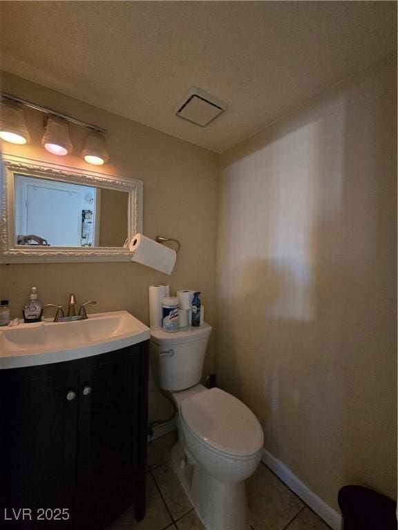 4612 Supreme Ct, Las Vegas, NV 89110 - bathroom with tile patterned flooring, vanity, toilet, and baseboards