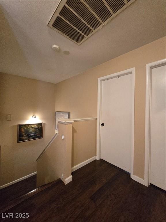 4612 Supreme Ct, Las Vegas, NV 89110 - hall with an upstairs landing, wood finished floors, and baseboards