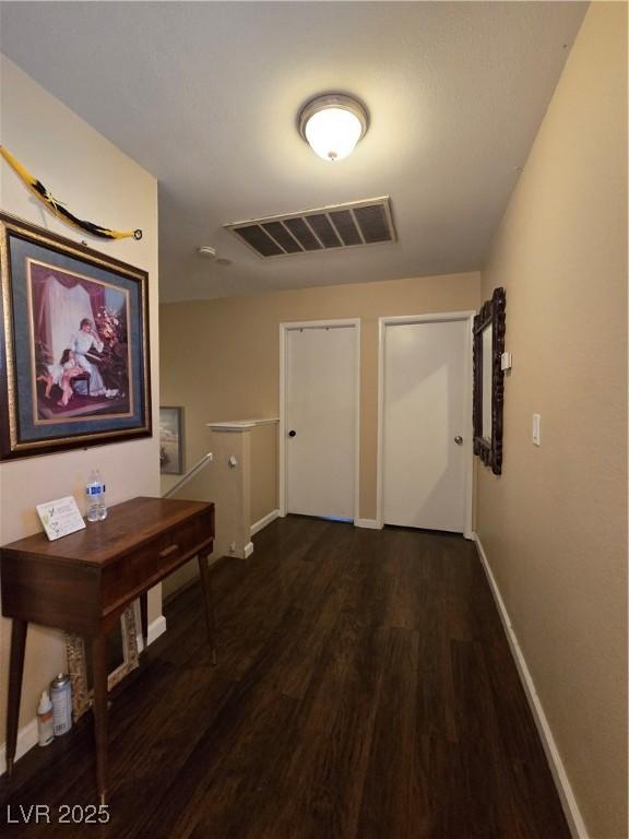 4612 Supreme Ct, Las Vegas, NV 89110 - hallway with dark wood-style flooring and baseboards