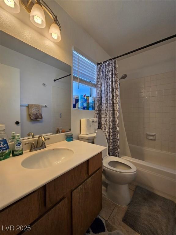 4612 Supreme Ct, Las Vegas, NV 89110 - full bath featuring vanity, shower / tub combo, toilet, and tile patterned floors
