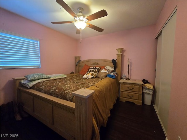 4612 Supreme Ct, Las Vegas, NV 89110 - bedroom featuring dark wood finished floors, a ceiling fan, a closet, and baseboards