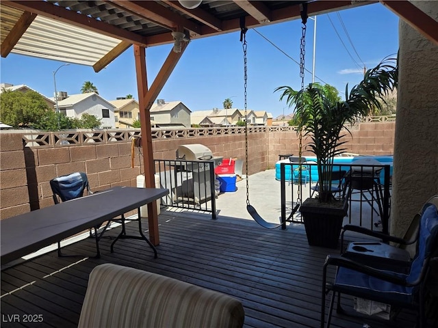 4612 Supreme Ct, Las Vegas, NV 89110 - wooden terrace featuring outdoor dining space, a fenced backyard, a pergola, and a residential view