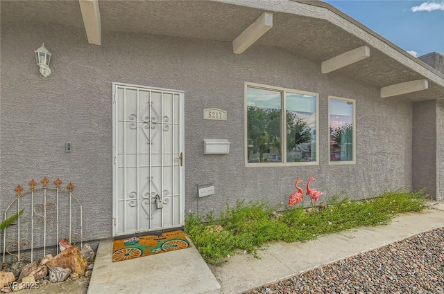 5217 Champions Ave, Las Vegas, NV 89142 - doorway to property featuring stucco siding