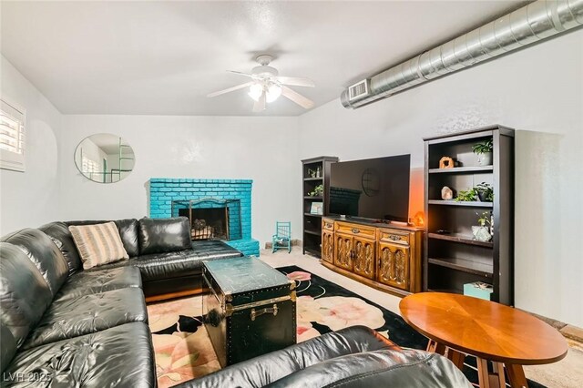5217 Champions Ave, Las Vegas, NV 89142 - living area with ceiling fan, carpet, and a fireplace