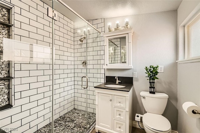 5217 Champions Ave, Las Vegas, NV 89142 - full bath featuring a shower stall, toilet, vanity, and a textured ceiling