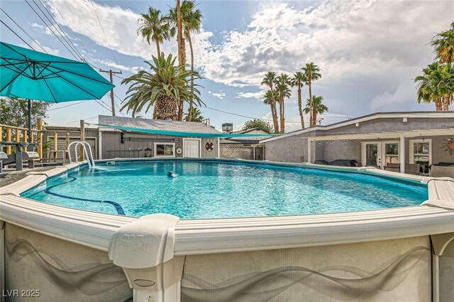 5217 Champions Ave, Las Vegas, NV 89142 - view of swimming pool with an outbuilding