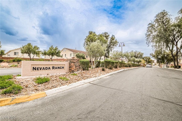 4833 Straight Flush Dr Unit 103, Las Vegas, NV 89122 - view of asphalt street with curbs, street lighting, and a residential view