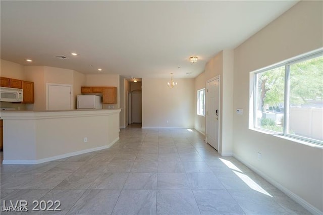 4833 Straight Flush Dr Unit 103, Las Vegas, NV 89122 - unfurnished living room featuring a chandelier, recessed lighting, and baseboards