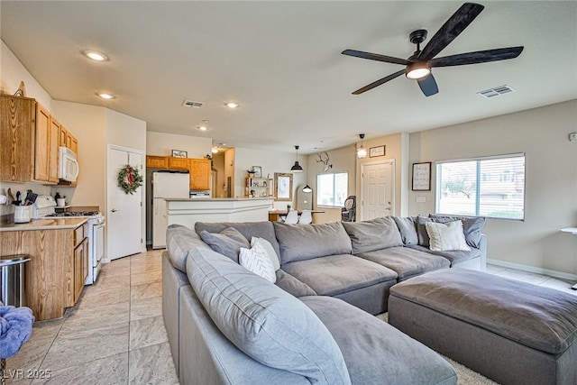 4833 Straight Flush Dr Unit 103, Las Vegas, NV 89122 - living room with plenty of natural light, a ceiling fan, recessed lighting, and light marble finish floors