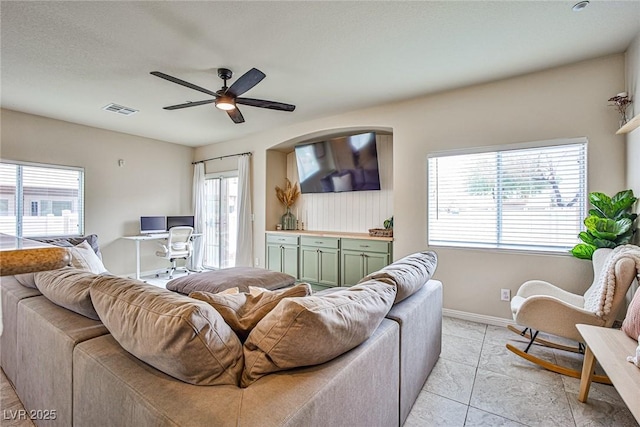 4833 Straight Flush Dr Unit 103, Las Vegas, NV 89122 - living room with ceiling fan, baseboards, a desk, and light tile patterned flooring