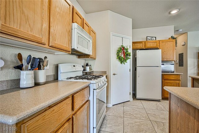 4833 Straight Flush Dr Unit 103, Las Vegas, NV 89122 - kitchen featuring white appliances and light countertops